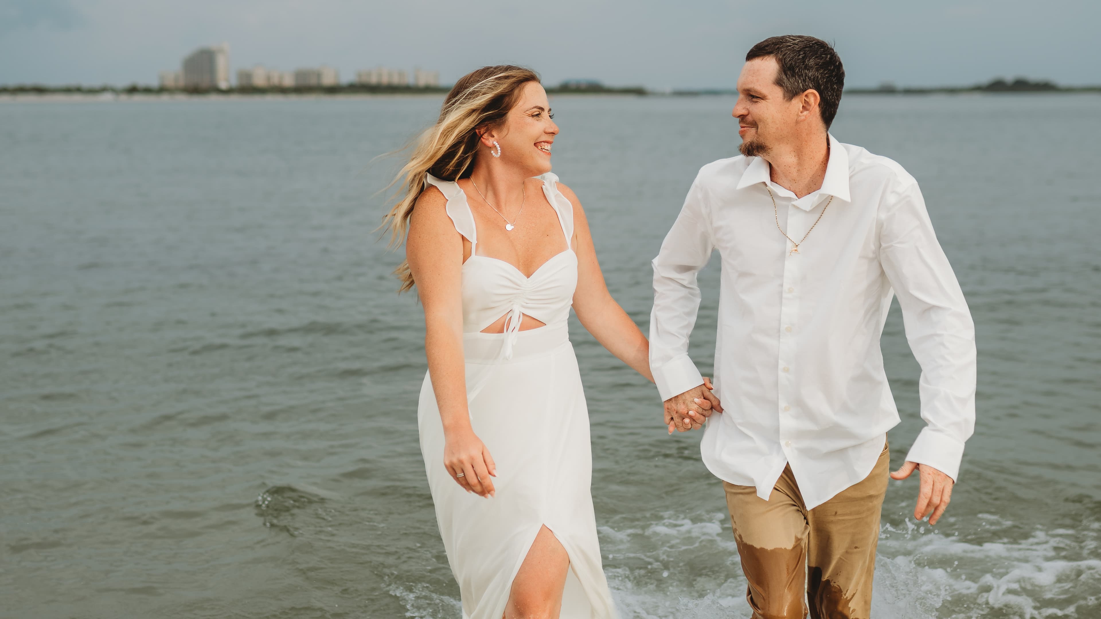 Heather and William walking through shallow water